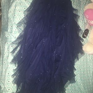 Long mullet style navy blue sparkly prom dress.